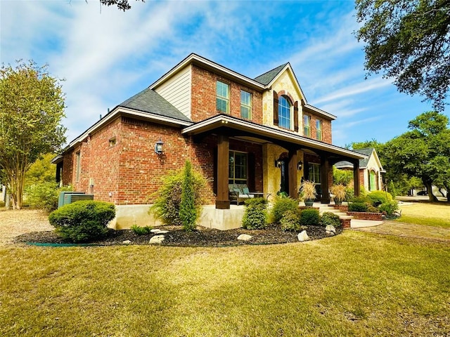 300 Copper Ln, Leander, TX 78641 - traditional home with covered porch, brick siding, and a front lawn