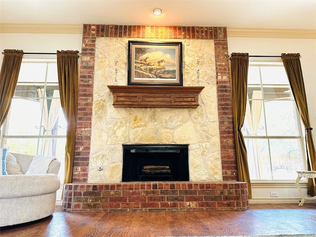 300 Copper Ln, Leander, TX 78641 - living area featuring wood finished floors, a large fireplace, and ornamental molding