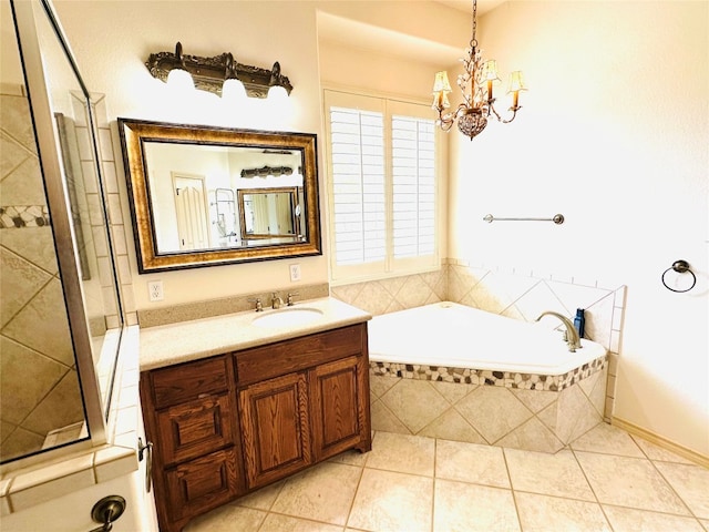 bathroom with vanity, a chandelier, tiled bath, and tile patterned flooring