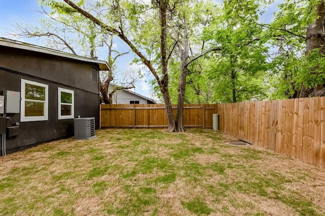 view of yard with central AC