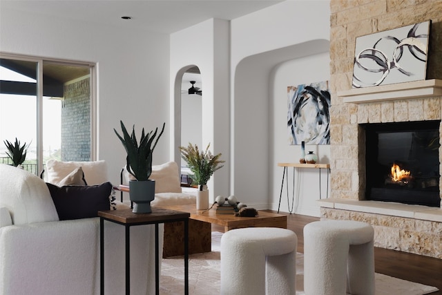 living room with hardwood / wood-style floors and a fireplace