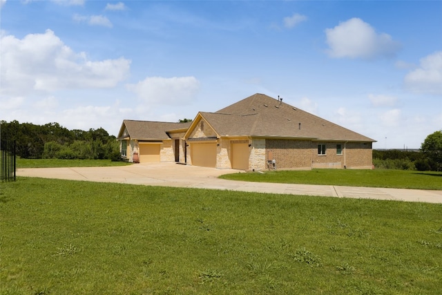 view of front facade with a front yard and a garage