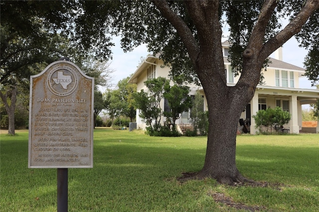 view of property's community with a lawn