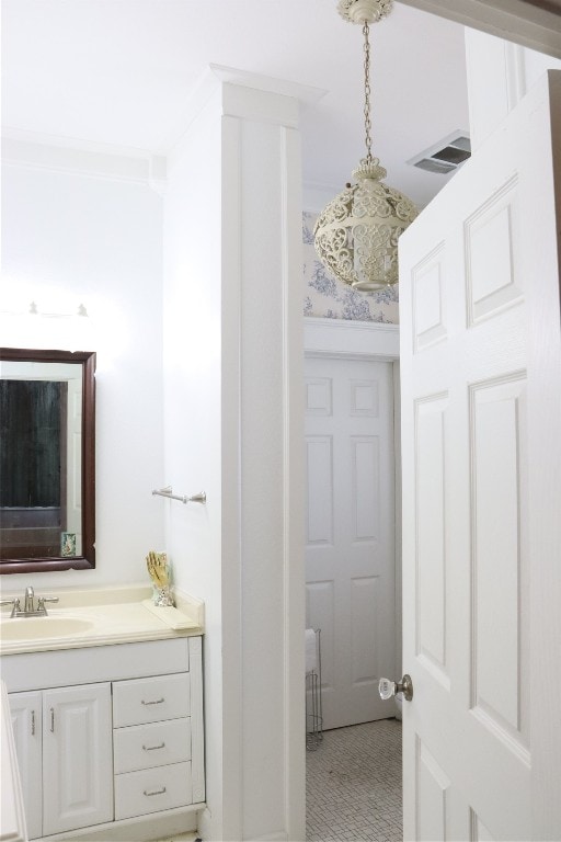 bathroom featuring vanity and crown molding