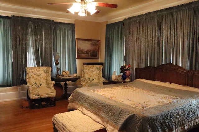 bedroom with hardwood / wood-style flooring and ceiling fan