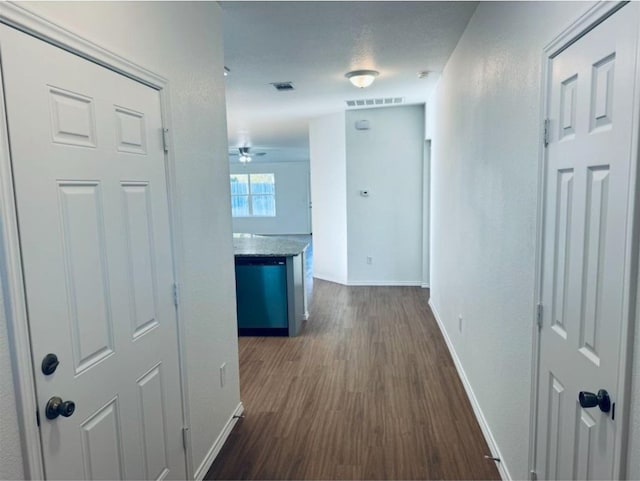 hall with dark wood-type flooring