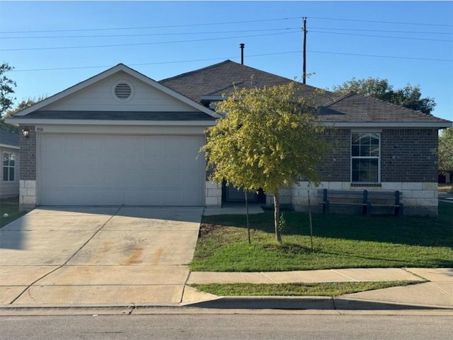 view of front of house with a garage and a front lawn