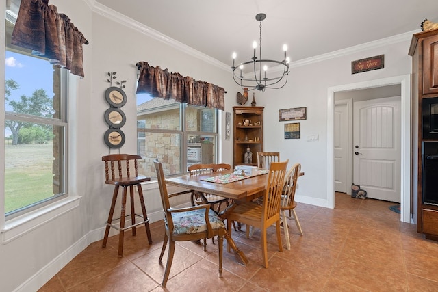 dining area featuring ornamental molding, a chandelier, and light tile patterned floors