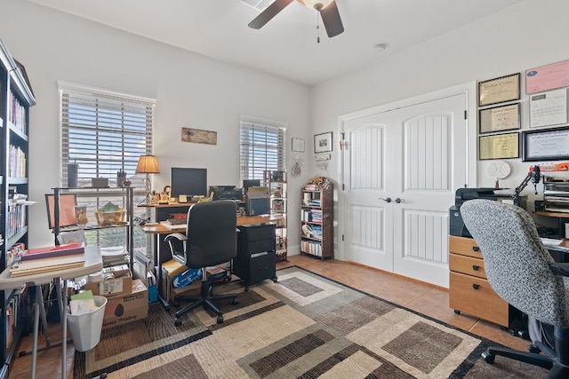 tiled home office with ceiling fan