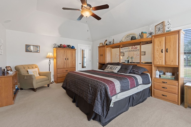 bedroom with vaulted ceiling, light colored carpet, and ceiling fan