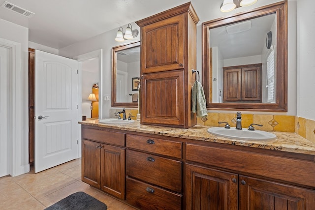 bathroom with vanity and tile patterned flooring