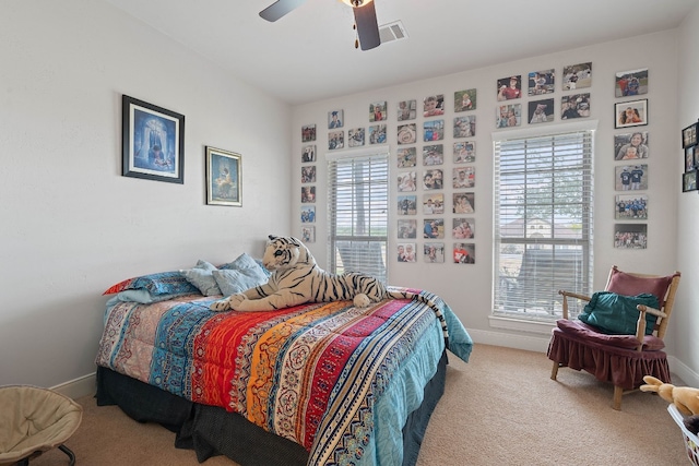 carpeted bedroom with ceiling fan