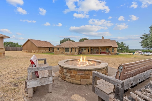 view of patio with a fire pit