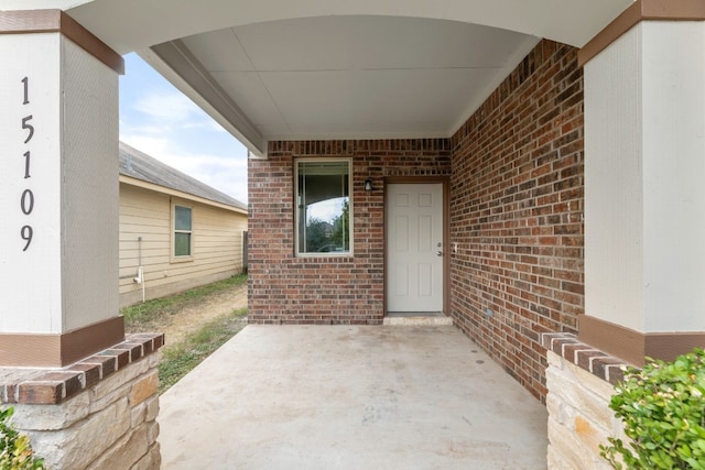 doorway to property with a patio area