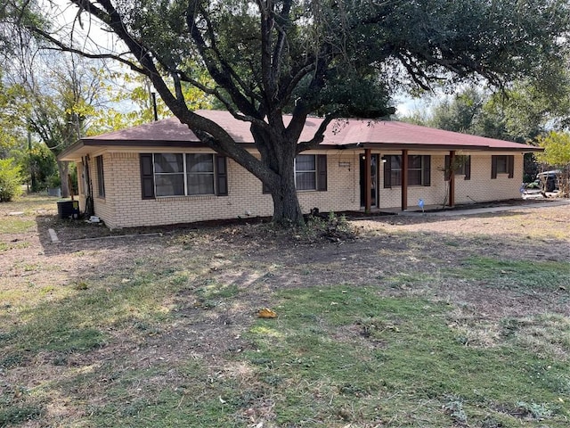 1133 W Bell St, Bartlett, TX 76511 - ranch-style house with brick siding and central AC unit