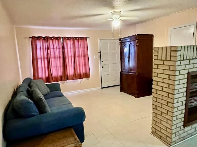 1133 W Bell St, Bartlett, TX 76511 - living room with a brick fireplace, a ceiling fan, and baseboards