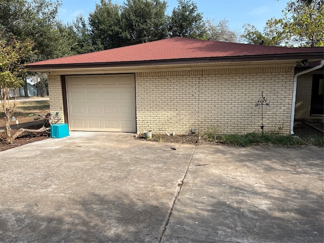 view of side of property with a garage