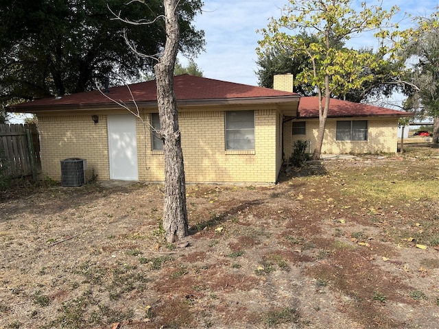 rear view of property featuring cooling unit