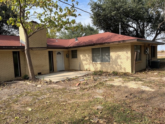 view of front of property featuring central AC and a patio area