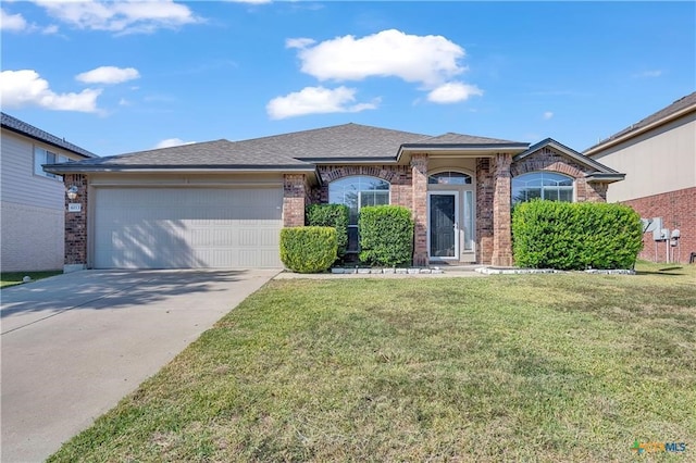 single story home featuring a front lawn and a garage