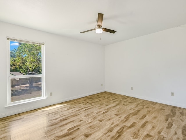 spare room with light hardwood / wood-style floors and ceiling fan