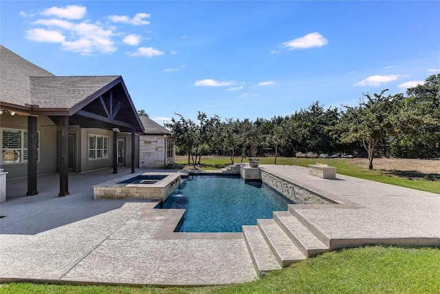 view of swimming pool featuring an in ground hot tub and a patio area