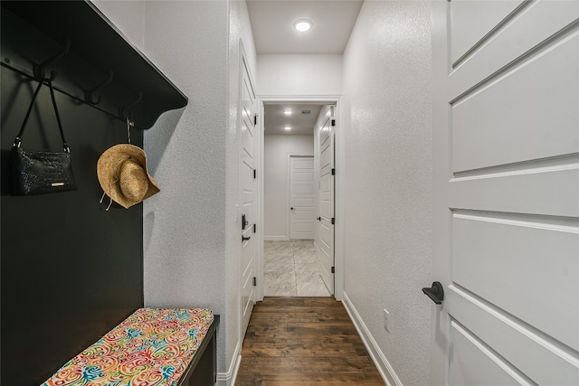 hallway featuring dark hardwood / wood-style floors