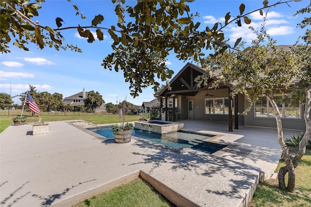 view of pool featuring an in ground hot tub, ceiling fan, and a patio