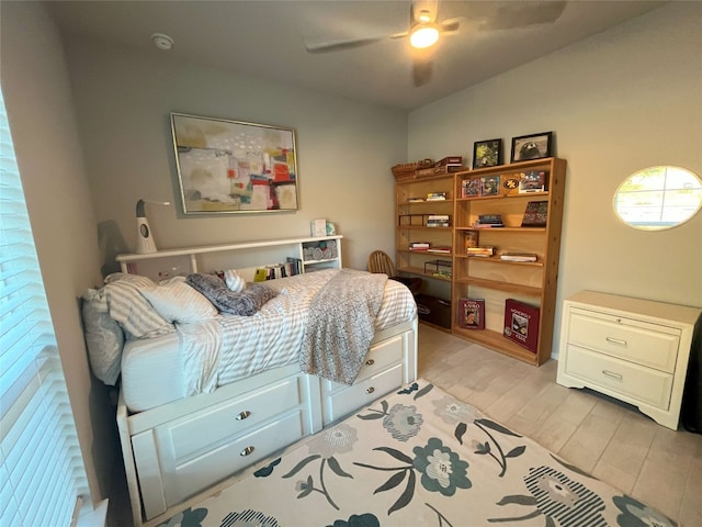 bedroom featuring light hardwood / wood-style flooring and ceiling fan