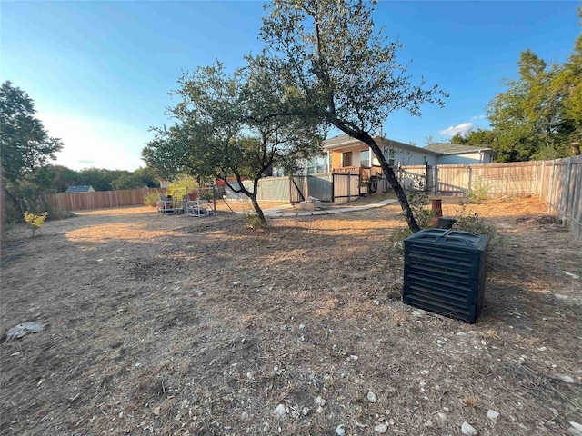 view of yard featuring cooling unit and a fenced backyard