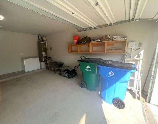 garage with water heater and fridge