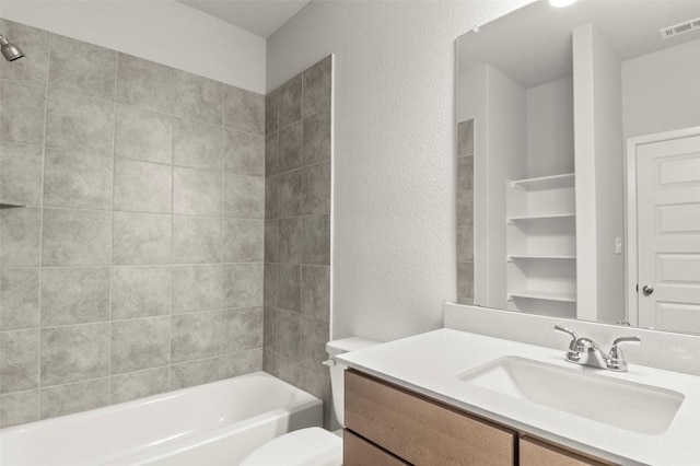 204 Lavender Ln, Elgin, TX 78621 - bathroom with vanity, shower / bathtub combination, and a textured wall