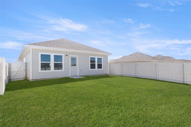 204 Lavender Ln, Elgin, TX 78621 - back of house featuring a fenced backyard and roof with shingles