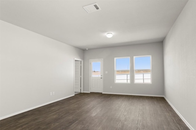 204 Lavender Ln, Elgin, TX 78621 - empty room featuring dark wood finished floors and baseboards