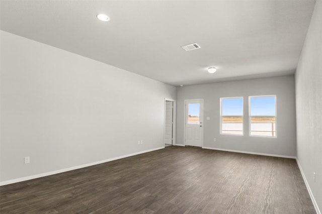 204 Lavender Ln, Elgin, TX 78621 - spare room featuring dark wood-style flooring and recessed lighting
