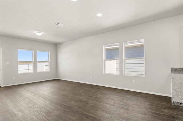 204 Lavender Ln, Elgin, TX 78621 - unfurnished room with dark wood-style flooring and baseboards