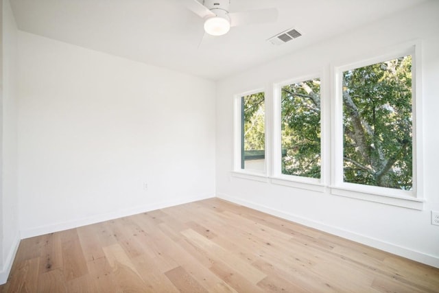 unfurnished room featuring ceiling fan and light hardwood / wood-style flooring