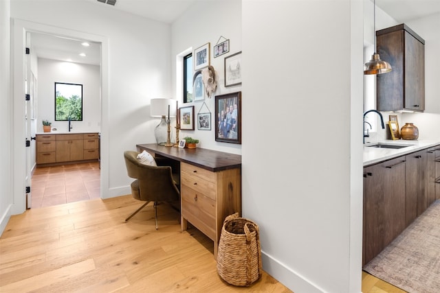 interior space featuring hardwood / wood-style flooring and sink