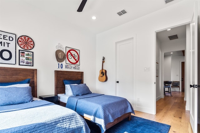 bedroom featuring hardwood / wood-style flooring and ceiling fan