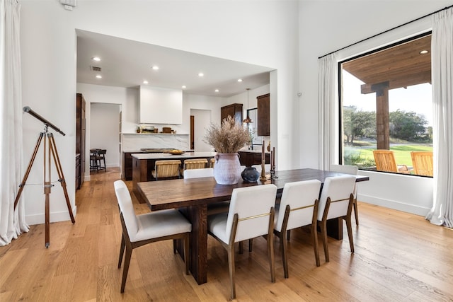 dining room with light hardwood / wood-style floors