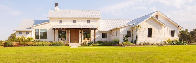 modern farmhouse featuring a front yard