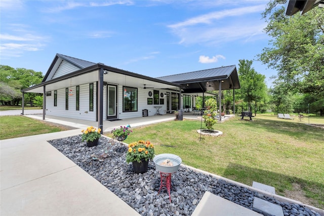 exterior space featuring a fire pit and a patio