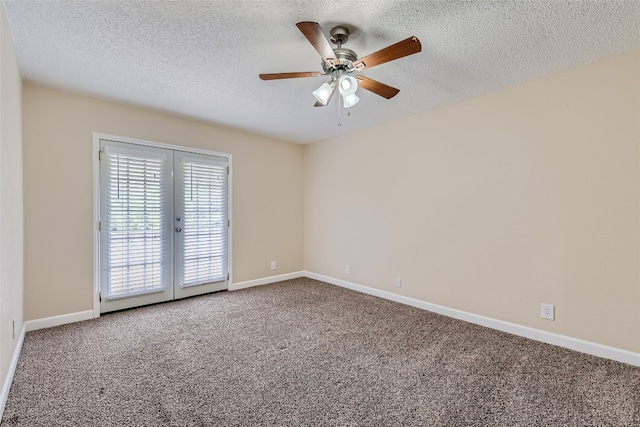 carpeted spare room with a textured ceiling and ceiling fan