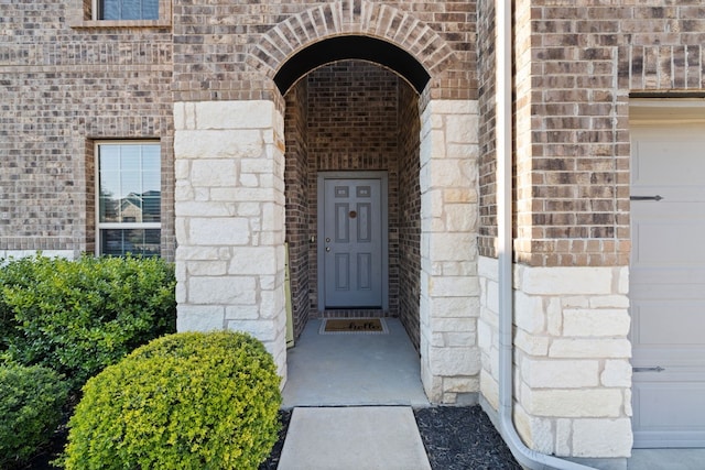 entrance to property featuring a garage