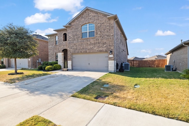 view of property with a front lawn, central AC unit, and a garage