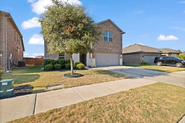 front of property with a front yard, central AC, and a garage