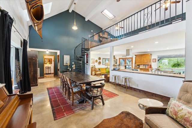 dining space featuring beamed ceiling and high vaulted ceiling