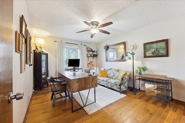 office space with hardwood / wood-style floors, a textured ceiling, and ceiling fan