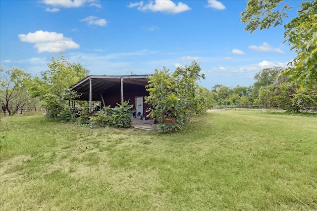 view of yard with a rural view