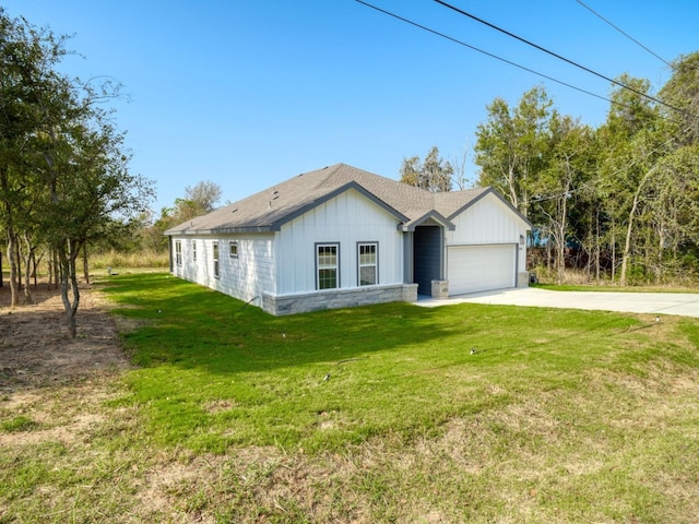 view of front of house with a garage and a front yard